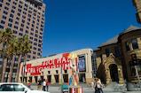 A building in downtown San José with community art project painted on it.